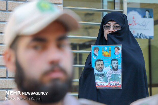 Two anonymous martyrs laid to rest in Payame Noor Uni.