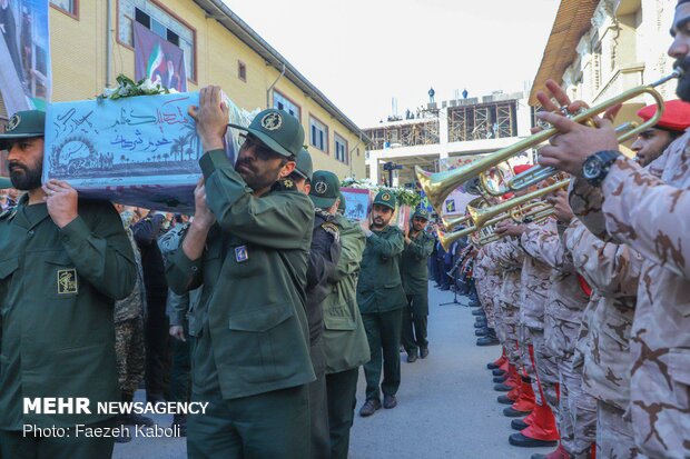 Two anonymous martyrs laid to rest in Payame Noor Uni.