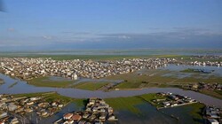 This photo by Fars news agency shows Aqqala in Golestan province inundated by flood waters.