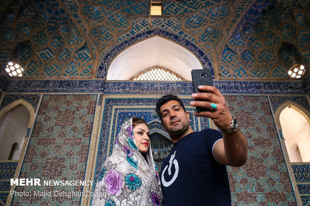 Travelers visit historical monuments in Nowruz