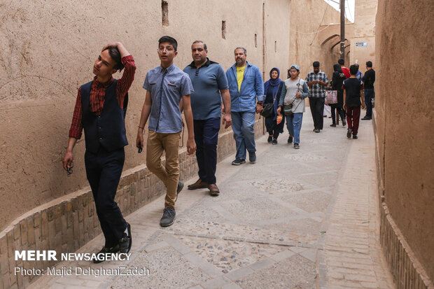 Travelers visit historical monuments in Nowruz