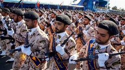 Members of Iran's Islamic Revolution Guards Corps (IRGC) march during the annual military parade marking the anniversary of the outbreak of the Iraqi-imposed war, in Tehran on September 22, 2018. (Photo by AFP)
