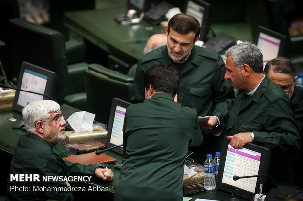 MPs dressed in IRGC uniform in open session