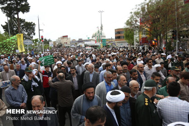 People in Qom march to protest at US' IRGC blacklisting