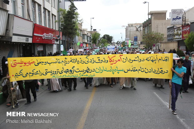 People in Qom march to protest at US' IRGC blacklisting