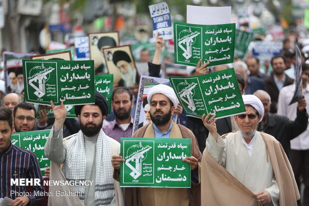 People in Qom march to protest at US' IRGC blacklisting