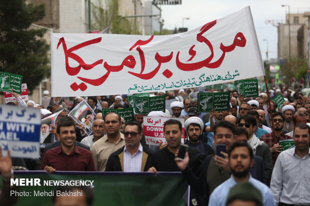 People in Qom march to protest at US' IRGC blacklisting