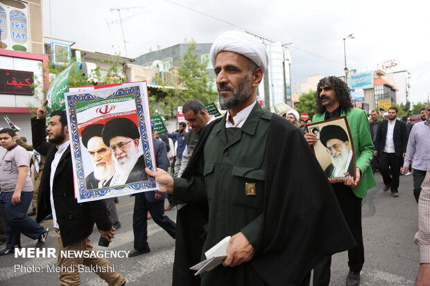 People in Qom march to protest at US' IRGC blacklisting