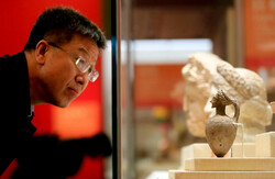 A visitor tours “The Splendor of Asia: An Exhibition of Asian Civilizations” at the National Museum of China in Beijing, May 13, 2019.