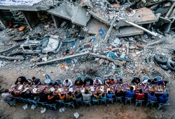 VIDEO: Iftar banquet in Gaza on rubble of building destroyed by Israeli regime