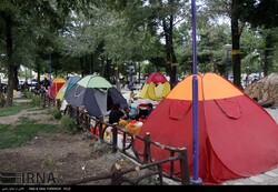Domestic travelers set up their tents in visits to Mazandaran province, northern Iran.