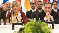 Iranian Deputy Foreign Minister Abbas Araghchi (R) and EU External Action Service Secretary General Helga Schmid (L) take part in a meeting of the Joint Commission of the Joint Comprehensive Plan of Action attended by the E3+2 (China, France, Germany, Russia, the United Kingdom) and Iran at the Palais Coburg in Vienna, Austria, on June 28, 2019. (Photo by AFP)