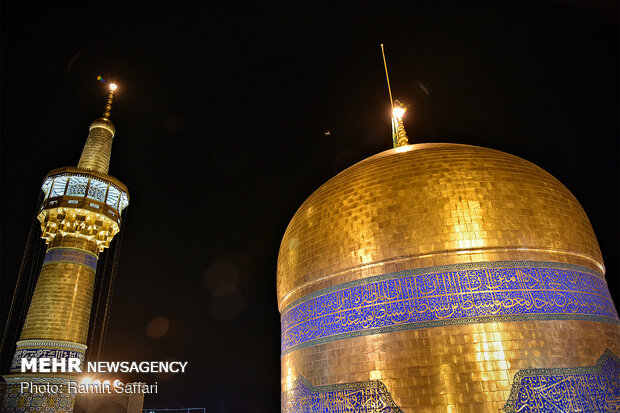 Ritual of changing flag of shrine of Imam Reza (AS)