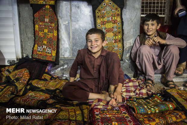 Afghan immigrants do business in Zahedan market