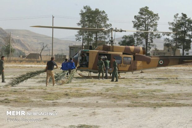 Army copters rescue people trapped in oak forest fires in Fars province