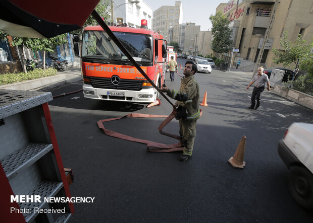 Firefighters extinguish warehouse fire in Tehran