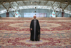 President Hassan Rouhani stands on a 600-square-meter handwoven carpet in an international carpet exhibit in Tabriz, August 1, 2019.