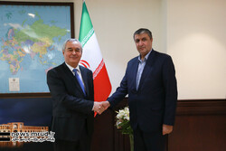 Tajikistan's ambassador to Iran, Nizamuddin Zahedi (L), held talks with Iranian Transport Minister Mohammad Eslami on Monday in Tehran