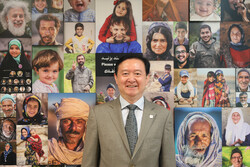 Chinese Ambassador to Iran Chang Hua poses for a photo during his visit to the Tehran-based Mehr news agency on August 6, 2019.