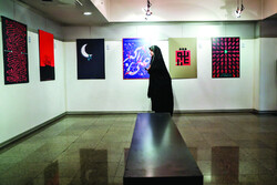 Art aficionado visits a poster exhibition on Ashura underway at the Abolfazl Aali Gallery of the Art Bureau in Tehran on September 1, 2019. (Mehr/Majid Asgaripur) 