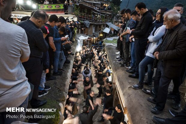 Traditional Muharram mourning ceremony "Alam Bandan" in Masuleh