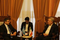 A file photo shows UNWTO Secretary-General Zurab Pololikashvili (L) meeting with Iran’s tourism chief Ali-Asghar Mounesan (R) in Tehran.