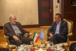 Iranian Health Minister Saeed Namaki (L) meets Director General of World Health Organization Tedros Adhanom Ghebreyesus