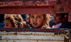 Civilians arrive in Tall Tamr in the Syrian Hasakeh province on October 10, 2019 after fleeing the Turkish bombardment. (AFP/Delil Souleiman)