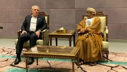 Iranian Minister of Cultural Heritage, Tourism and Handicrafts Ali Asghar Mounesan (L) talks to his Omani counterpart Ahmed bin Nasser al-Mahrizi in Muscat, October 21, 2019.
