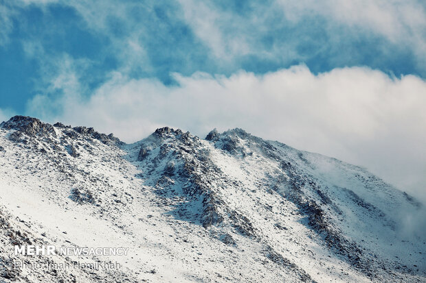 Snow whitens Hamedan's mountains