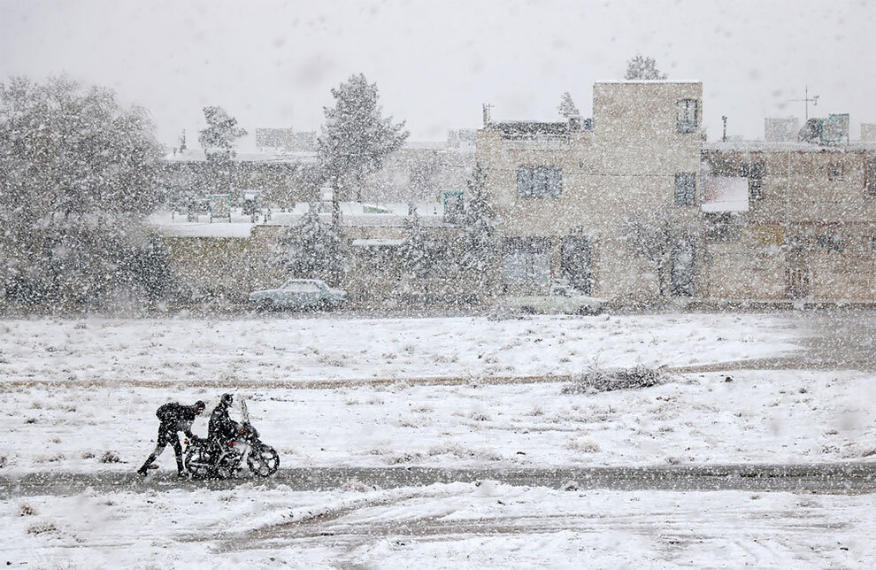 “Motorcycle Caught in Snow”