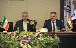 Iranian Energy Minister Reza Ardakanian (L) and Syrian Minister of Electricity Mohammad Zuheir Kharboutli