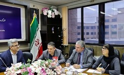 Iran’s deputy tourism minister Vali Teymouri (1st L) and UNWTO advisor Marcello Notarianni (2nd R) exchange views on developing the country’s comprehensive tourism plan in a Tehran meeting, December 7, 2019.