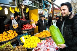 You can hear her breath in the face of parents purchasing and setting out dried nuts, cookies, pomegranates and watermelons; and impatient children who are waiting for her to arrive!