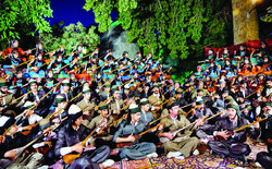 Tamboura players of the Mastur ensemble perform in an undated photo. (file photo/IRNA/Bahman Zarei)