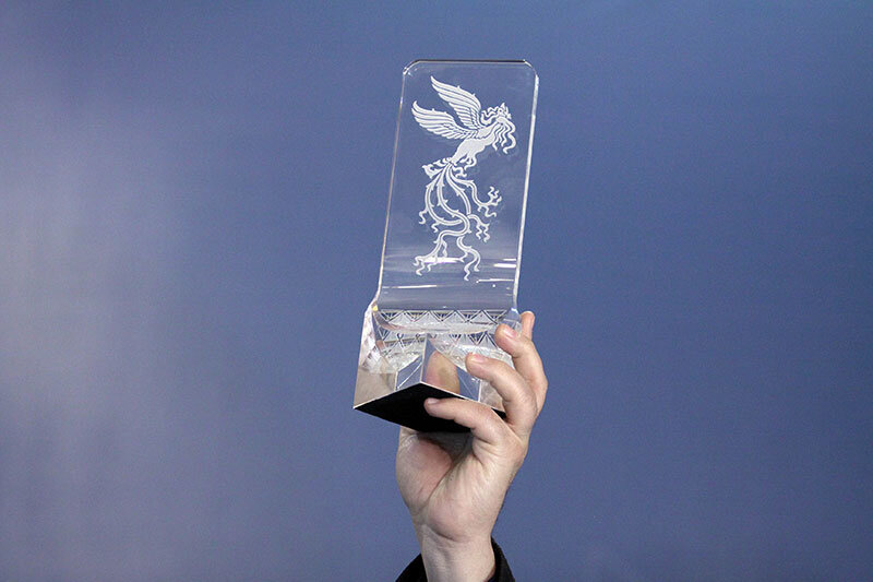 A winner holds his Crystal Simorgh during the closing ceremony of during the 37th Fajr Film Festival at Tehran’s Milad Tower on February 11, 2019.
