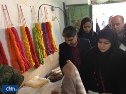 Cultural Heritage, Tourism and Handicrafts Deputy Minister Pouya Mahmoudian (front R) visits a crafts workshop in the village of Khorashad, northeast Iran, December 31, 2019.