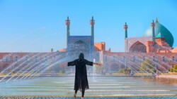 A sightseer revels in the picturesque atmosphere of the UNESCO-registered Imam Square in Isfahan, central Iran. (Shutterstock)