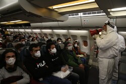 Iranian students confined in Wuhan return home