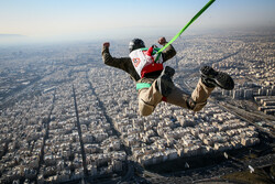 Parachuting from Milad Tower on occasion of Islamic Rev. anniv.