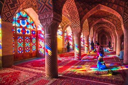  Travelers visit the picturesque interior hall of the 19th-century Nasir al-Molk Mosque in Shiraz, southern Iran.   