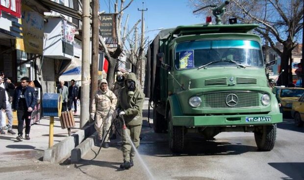 گندزدایی از اماکن شهر کرمانشاه توسط نیروهای سپاه و شهرداری