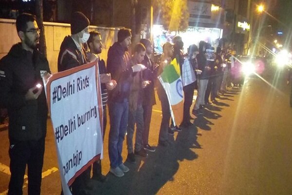 University students light candles in solidarity with Indian Muslims