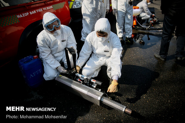 Disinfecting Valiasr St. in Tehran due to coronavirus outbreak
