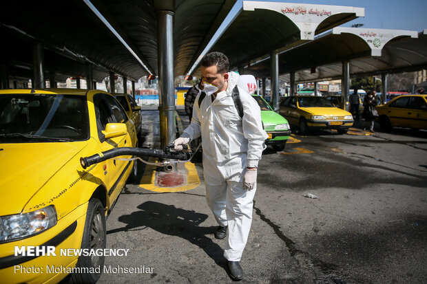 Disinfecting Valiasr St. in Tehran due to coronavirus outbreak
