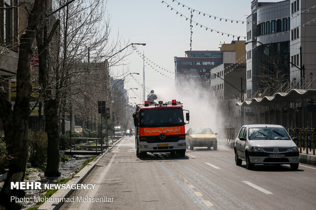 Disinfecting Valiasr St. in Tehran due to coronavirus outbreak
