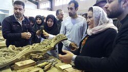 World Crafts Council-Asia Pacific Region Director Ghada Hijavi (2nd R) visits a woodcarving workshop in Iran’s Malayer in December 2019.