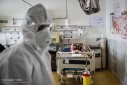 Global coronavirus death toll climbs to 7,989