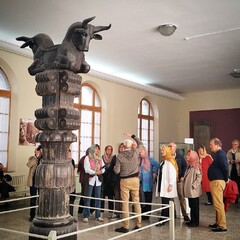 People visit a majestic capital of a column from Persepolis, the ceremonial capital city of the Persian Achaemenid Empire (ca. 550-330 BC), at the National Museum of Iran.