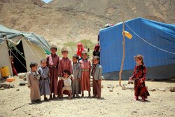 Yemeni children standing outside a tent at a makeshift camp for Internally Displaced Persons after west of Marib city, on 8 May 2016. (Photo: AFP)